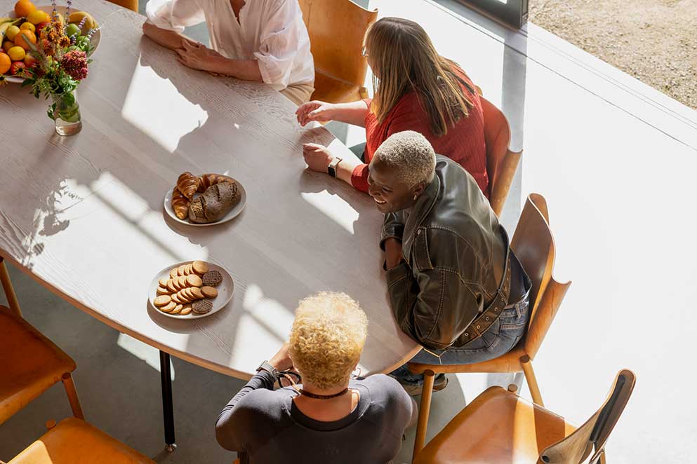 Aerial shot of four ladies chatting