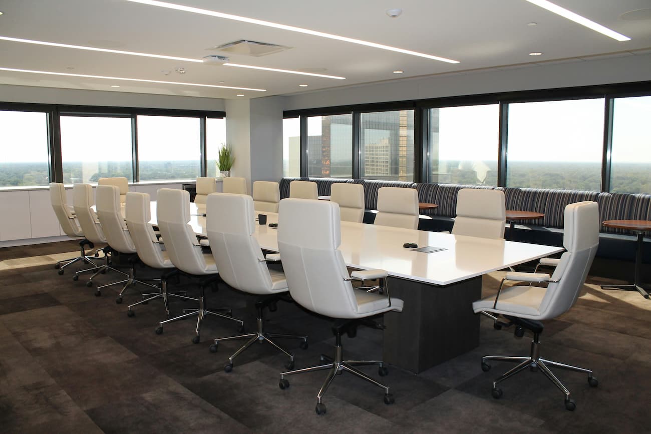 Boardroom with white table and chairs