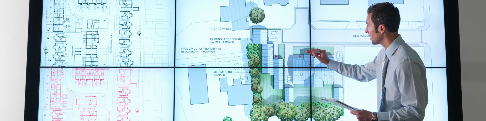 corporate man presenting real estate plans