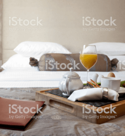 A continental breakfast laid out in a hotel or B&B bedroom
