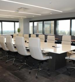 Boardroom with white table and chairs