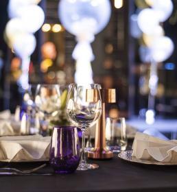 dining table set with wine glasses