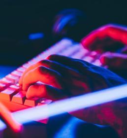 hands typing on a keyboard