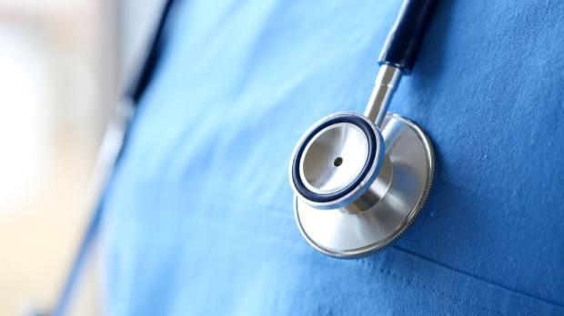 Stethoscope on doctor chest