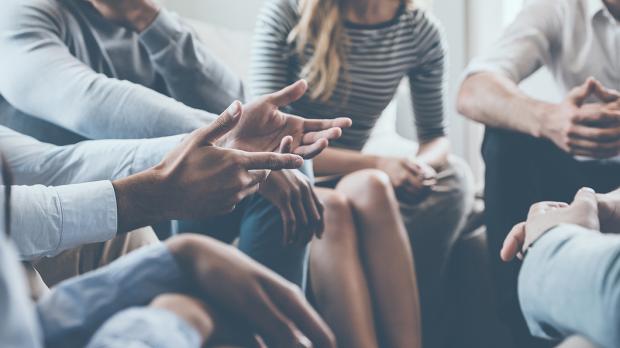 people in a health session talking