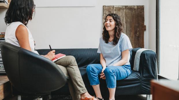 two women sitting and talking health assesement