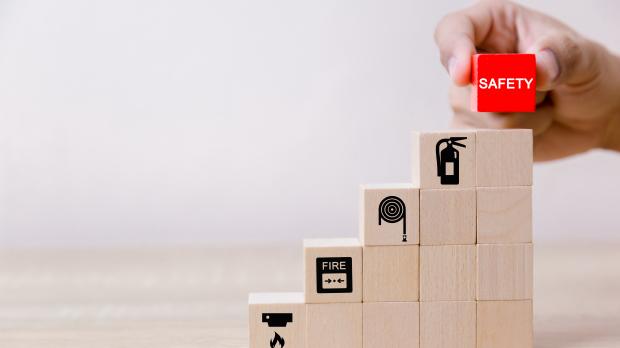 Wooden building blocks displaying safety related images