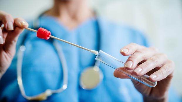 nurse doing swab testing