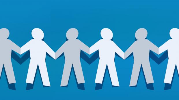 paper chain cut out in the shape of people