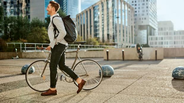 Colleagues talking in office - new mental health guide for recruiters - Howden