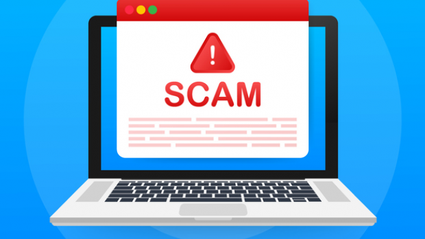 Laptop with Scam warning sign