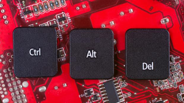 Control, alt and delete keys sitting on circuit board