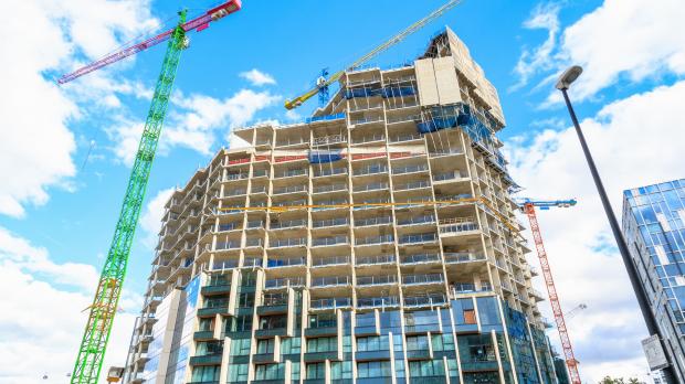 High-rise building under construction and crane