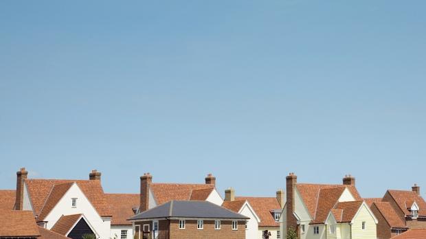 Roofs of houses against a blue sky