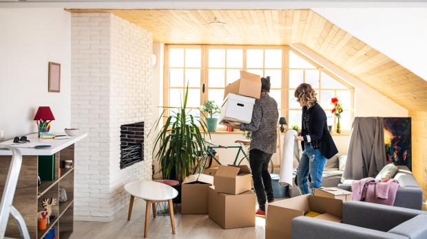 Couple packing boxes ready to move house