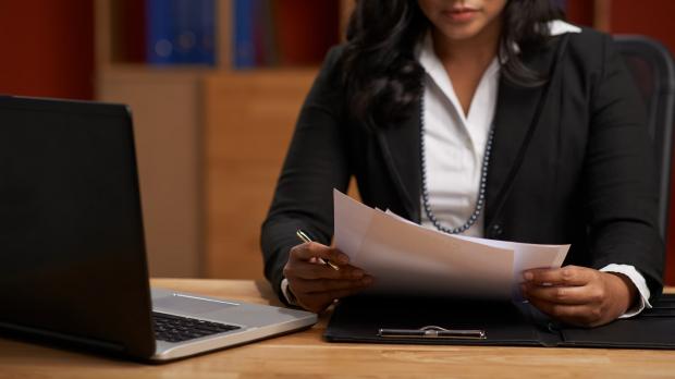 Female solicitor reviewing paperwork