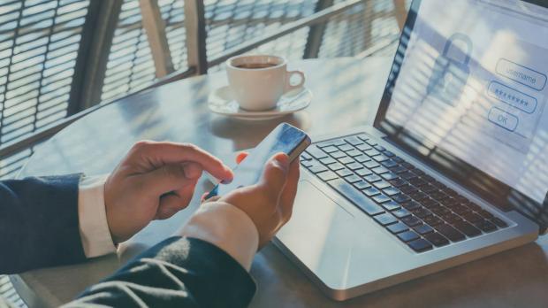 Man logging into a laptop