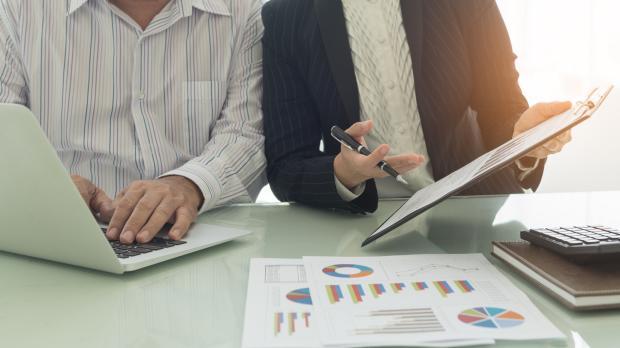 Man and woman reading through analysis