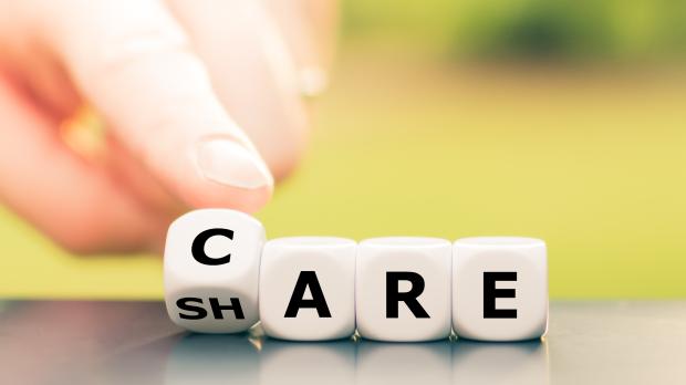 Dice form the words "care" and "share"