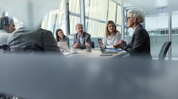 Partners sitting at the boardroom table