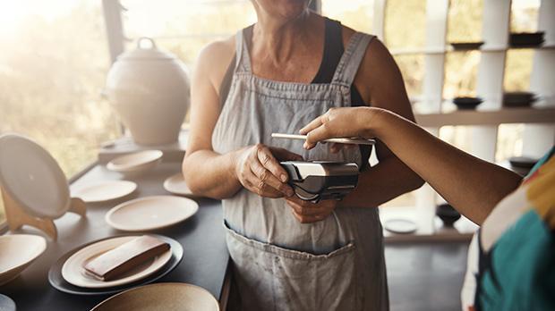 Iphone being used on card machine
