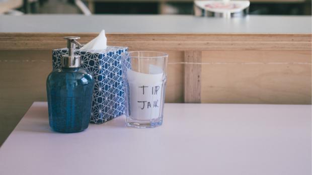 tip jars on a work surface 