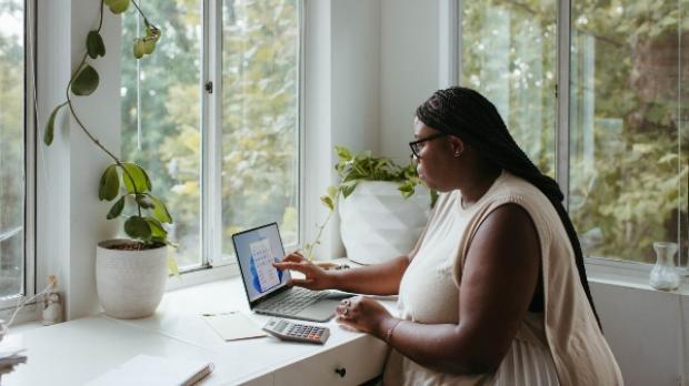 woman reviews work at home