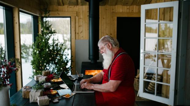 Santa on his laptop doing his admin