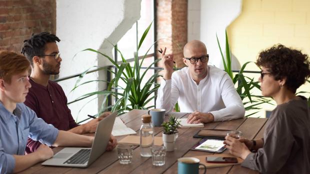 Group sat at table in a meeting