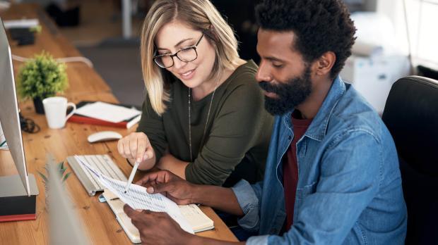 Pair of people looking at regulation