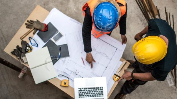 construction_workers_reviewing_build_plans