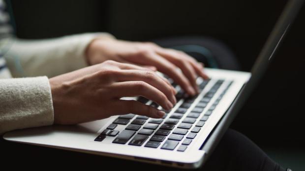 typing on a laptop keyboard