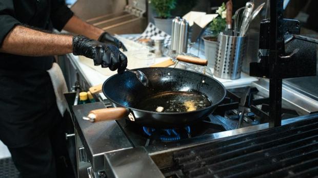 chef frying in a wok 