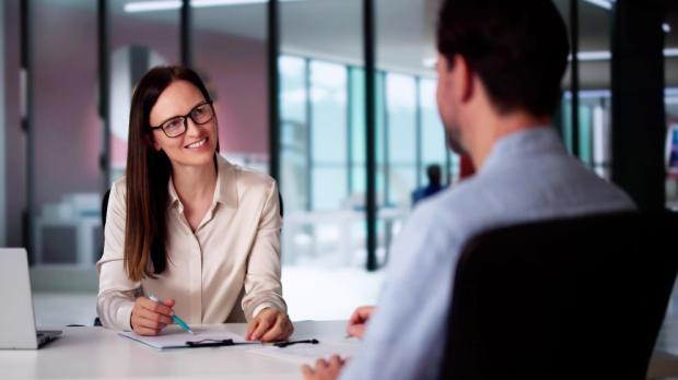 woman interviewing man 