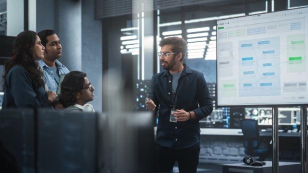 group of people having watching a man present data
