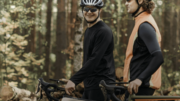 People riding on bikes, lauging