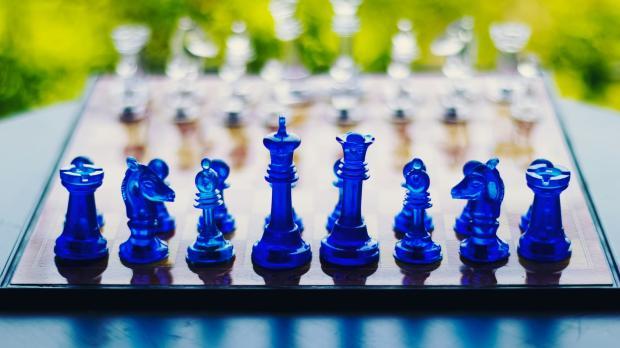 Blue and white chess pieces set for a game