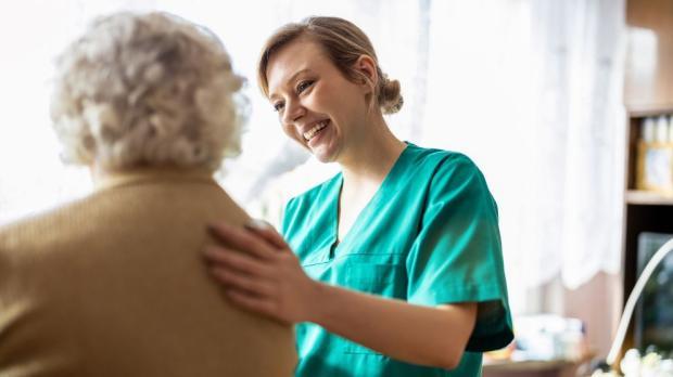 woman comforts elderly