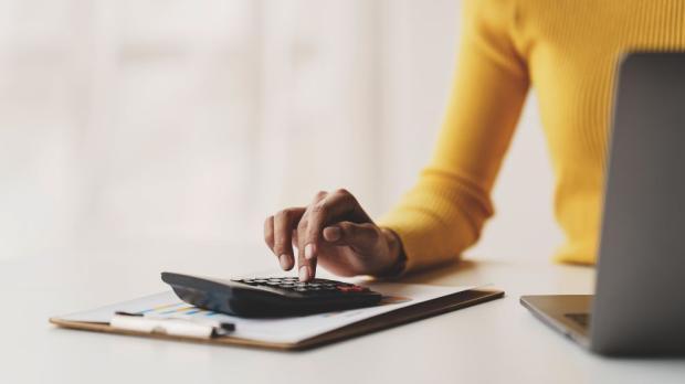 woman uses calculator