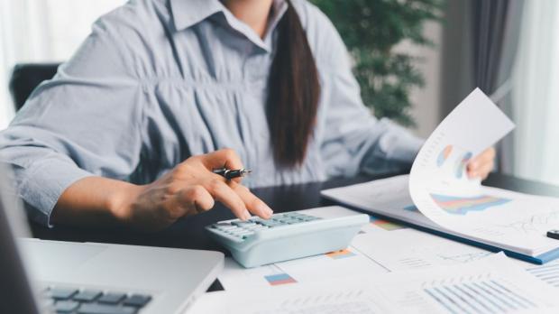 woman calculates her tax