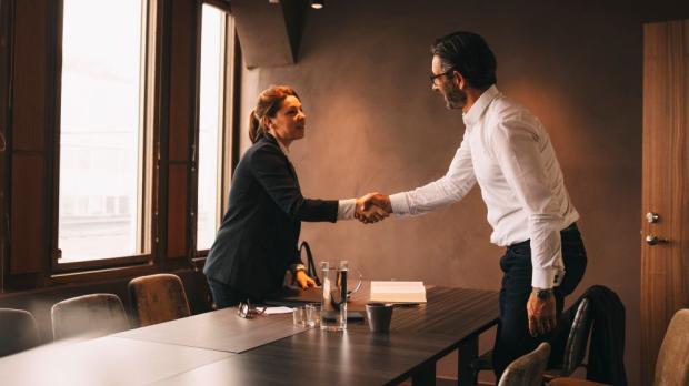 two business people shake hands