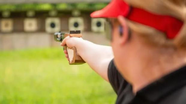 person firing at a target