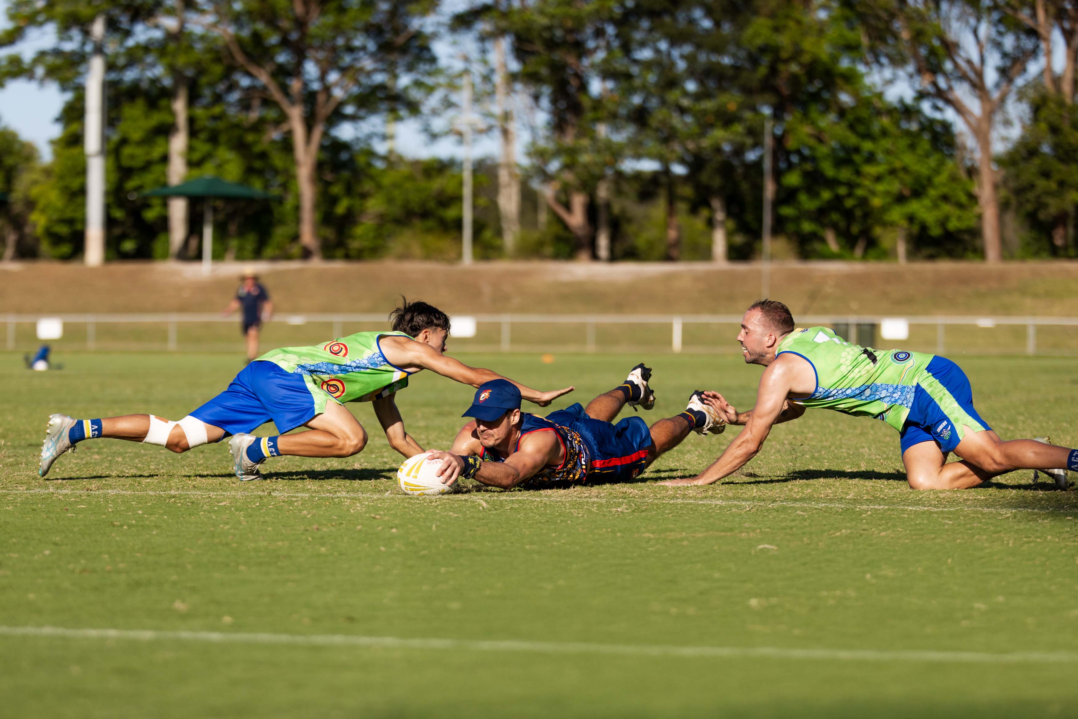 man scoring a try during a touch football game