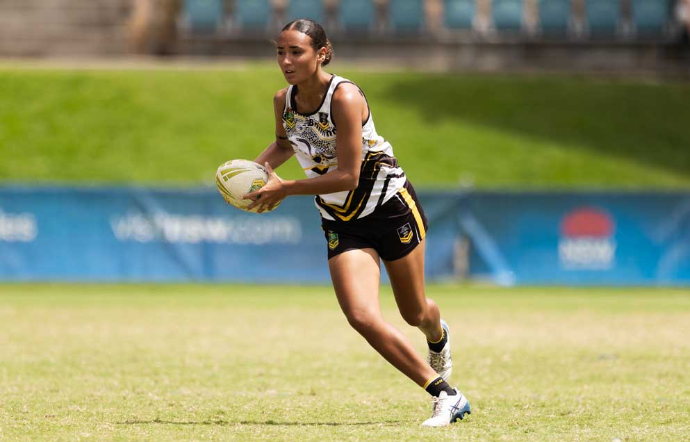 woman holding touch football during a game