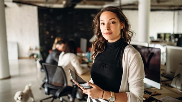 Confident business woman looking into the camera