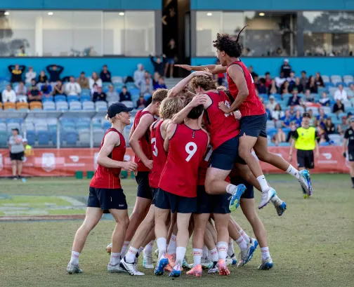 team celebrating after scoring in touch football
