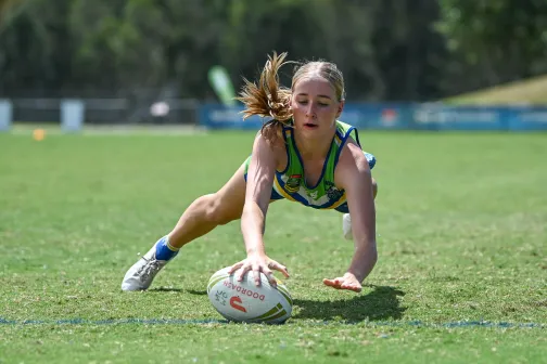 A young woman playing touch football