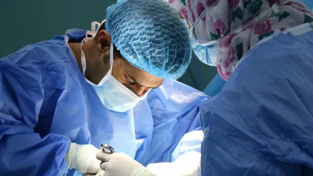 Surgeons performing an operation