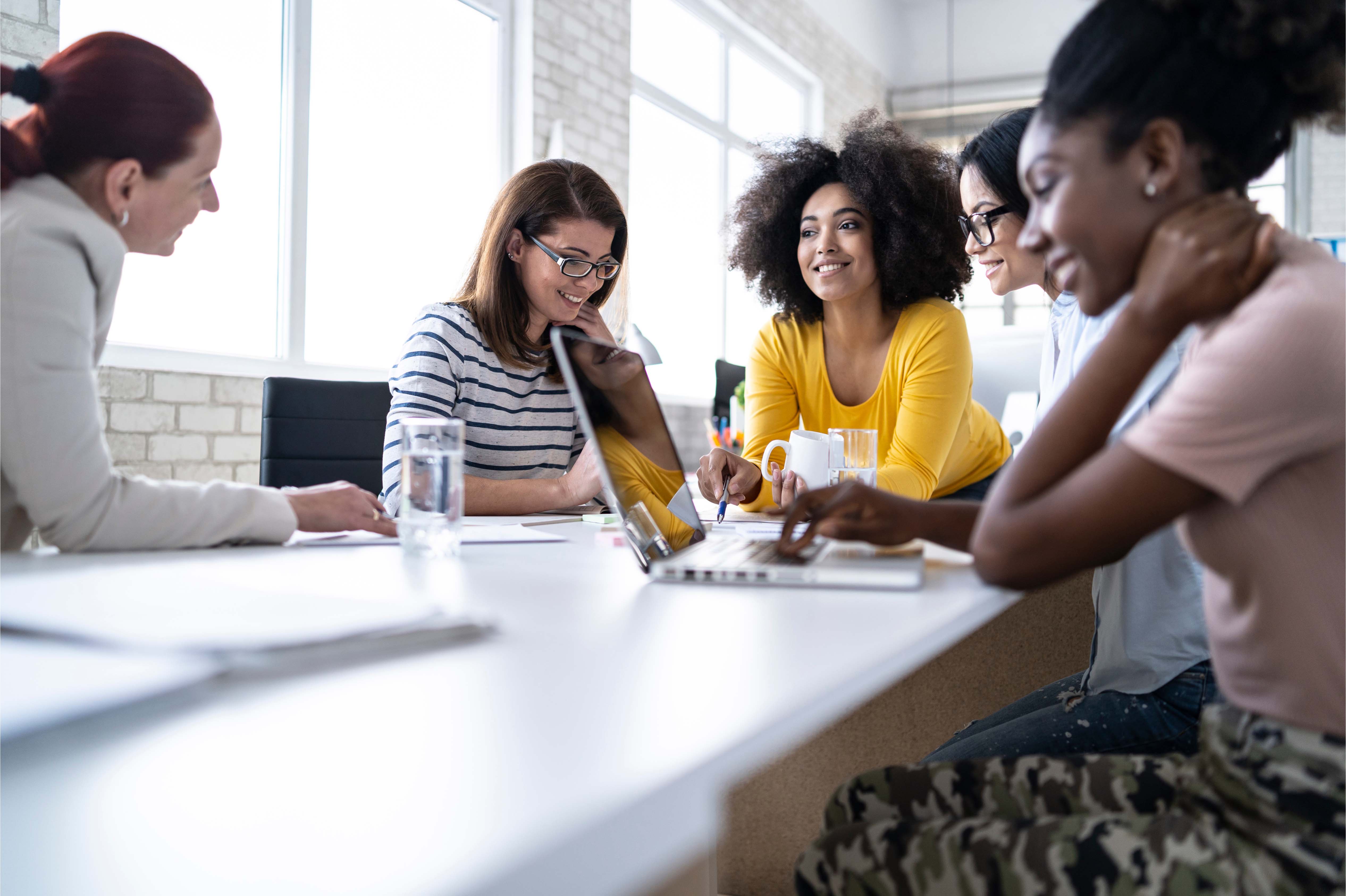 group of female colleagues working in the office