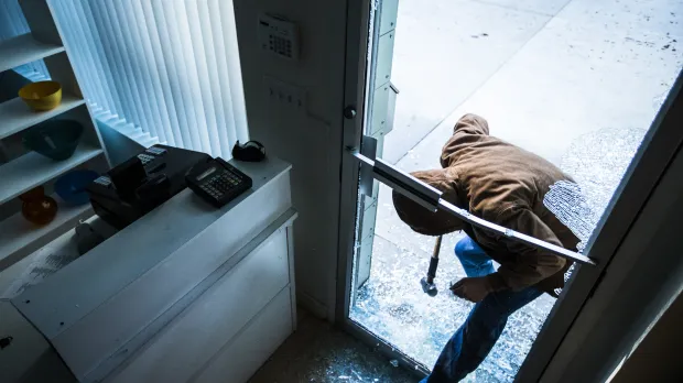 Fidelity and Money A robber breaks in to a business using a sledgehammer